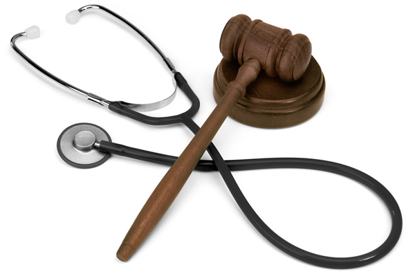 gavel and stethescope on white background